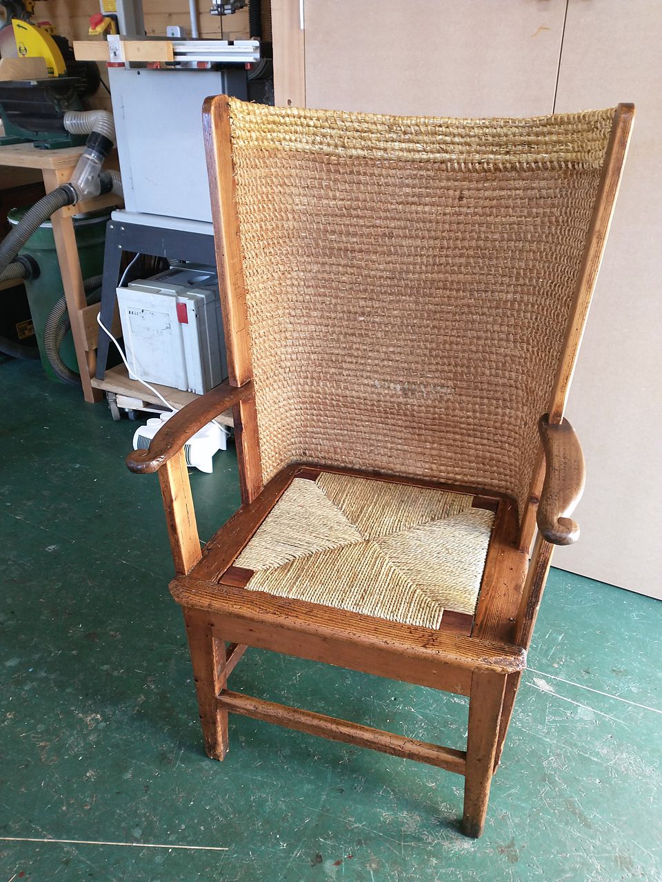 The same Orkney chair after restoration, with its straw back and a new rush seat